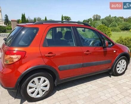 Помаранчевий Сузукі СХ4, об'ємом двигуна 1.59 л та пробігом 226 тис. км за 8000 $, фото 4 на Automoto.ua