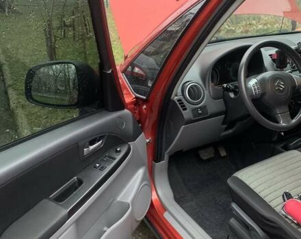 Оранжевый Сузуки СХ4, объемом двигателя 1.59 л и пробегом 105 тыс. км за 9200 $, фото 1 на Automoto.ua