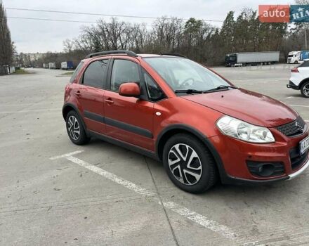 Оранжевый Сузуки СХ4, объемом двигателя 1.59 л и пробегом 136 тыс. км за 9900 $, фото 1 на Automoto.ua