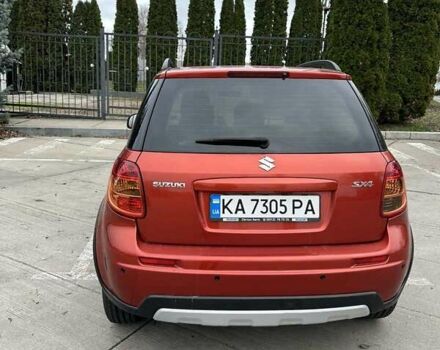 Оранжевый Сузуки СХ4, объемом двигателя 1.59 л и пробегом 136 тыс. км за 9900 $, фото 3 на Automoto.ua