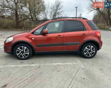 Оранжевый Сузуки СХ4, объемом двигателя 1.59 л и пробегом 136 тыс. км за 9900 $, фото 4 на Automoto.ua