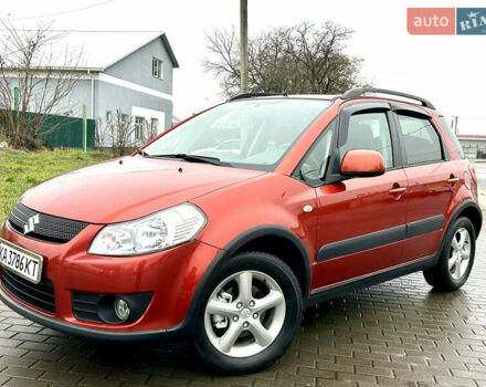 Оранжевый Сузуки СХ4, объемом двигателя 1.6 л и пробегом 240 тыс. км за 7500 $, фото 1 на Automoto.ua