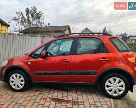 Оранжевый Сузуки СХ4, объемом двигателя 1.59 л и пробегом 92 тыс. км за 7000 $, фото 1 на Automoto.ua
