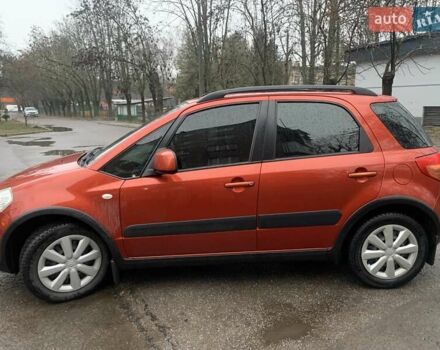 Оранжевый Сузуки СХ4, объемом двигателя 1.59 л и пробегом 105 тыс. км за 9200 $, фото 1 на Automoto.ua