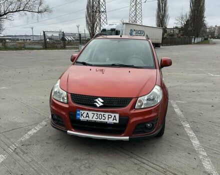 Оранжевый Сузуки СХ4, объемом двигателя 1.59 л и пробегом 136 тыс. км за 9900 $, фото 1 на Automoto.ua