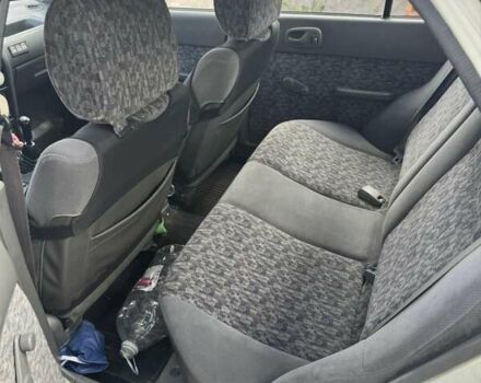 Білий Сузукі Свифт, об'ємом двигуна 1.32 л та пробігом 315 тис. км за 1500 $, фото 8 на Automoto.ua
