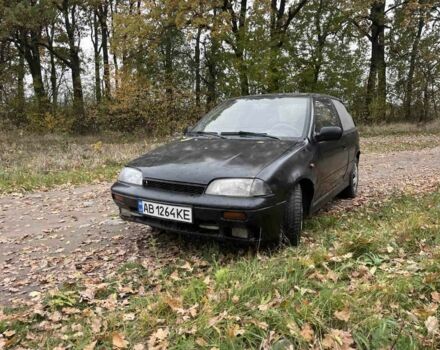 Чорний Сузукі Свифт, об'ємом двигуна 1.3 л та пробігом 320 тис. км за 500 $, фото 1 на Automoto.ua