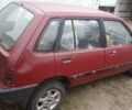 Красный Сузуки Свифт, объемом двигателя 1 л и пробегом 300 тыс. км за 242 $, фото 1 на Automoto.ua