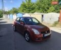 Червоний Сузукі Свифт, об'ємом двигуна 1.49 л та пробігом 157 тис. км за 5250 $, фото 1 на Automoto.ua