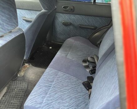 Красный Сузуки Свифт, объемом двигателя 1 л и пробегом 155 тыс. км за 750 $, фото 3 на Automoto.ua