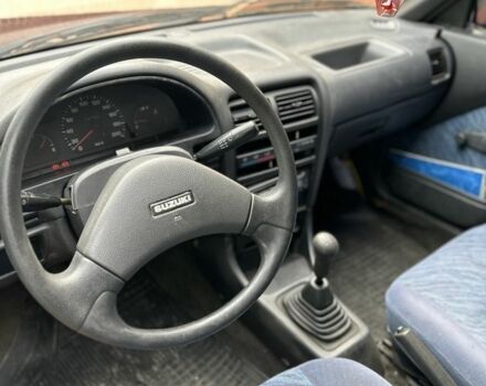 Красный Сузуки Свифт, объемом двигателя 1 л и пробегом 155 тыс. км за 750 $, фото 4 на Automoto.ua