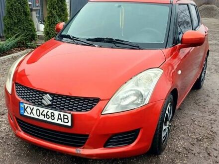 Червоний Сузукі Свифт, об'ємом двигуна 1.24 л та пробігом 235 тис. км за 6990 $, фото 1 на Automoto.ua