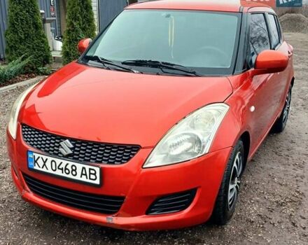 Червоний Сузукі Свифт, об'ємом двигуна 1.24 л та пробігом 235 тис. км за 6990 $, фото 1 на Automoto.ua