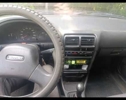 Синий Сузуки Свифт, объемом двигателя 1.3 л и пробегом 150 тыс. км за 834 $, фото 10 на Automoto.ua