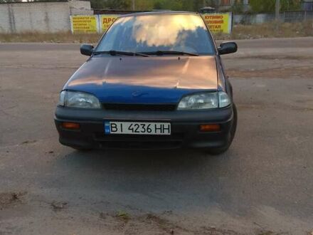 Синий Сузуки Свифт, объемом двигателя 1 л и пробегом 470 тыс. км за 1550 $, фото 1 на Automoto.ua