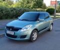Зелений Сузукі Свифт, об'ємом двигуна 1.24 л та пробігом 179 тис. км за 7400 $, фото 1 на Automoto.ua