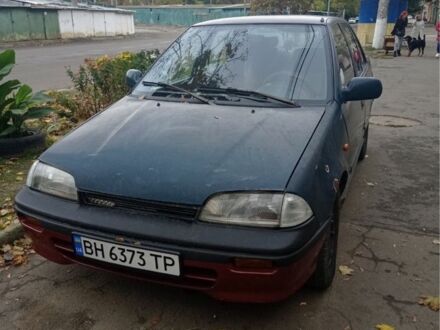 Зеленый Сузуки Свифт, объемом двигателя 1.3 л и пробегом 427 тыс. км за 700 $, фото 1 на Automoto.ua