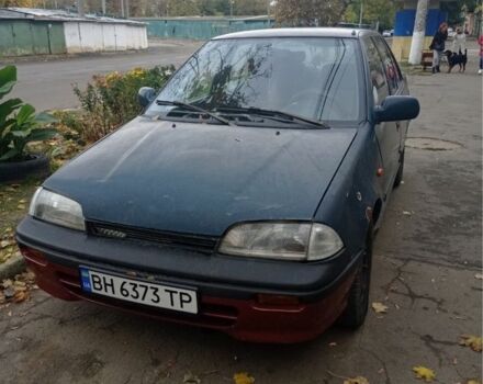 Зеленый Сузуки Свифт, объемом двигателя 1.3 л и пробегом 427 тыс. км за 700 $, фото 1 на Automoto.ua