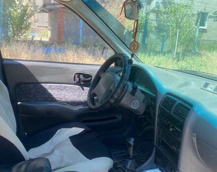 Зелений Сузукі Свифт, об'ємом двигуна 1.3 л та пробігом 333 тис. км за 1600 $, фото 1 на Automoto.ua