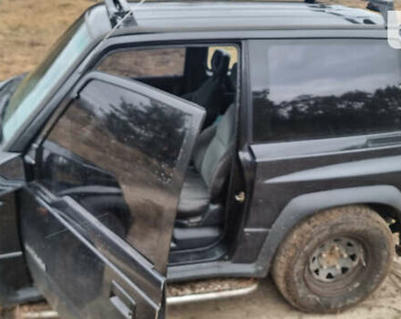 Черный Сузуки Витара, объемом двигателя 1.59 л и пробегом 303 тыс. км за 4950 $, фото 3 на Automoto.ua