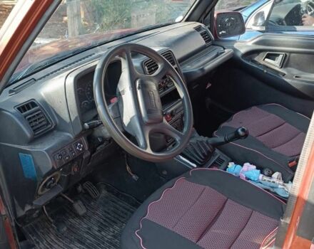 Червоний Сузукі Sidekick, об'ємом двигуна 1.6 л та пробігом 300 тис. км за 3000 $, фото 6 на Automoto.ua