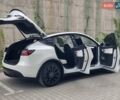 Белый Тесла Model Y, объемом двигателя 0 л и пробегом 98 тыс. км за 26499 $, фото 19 на Automoto.ua