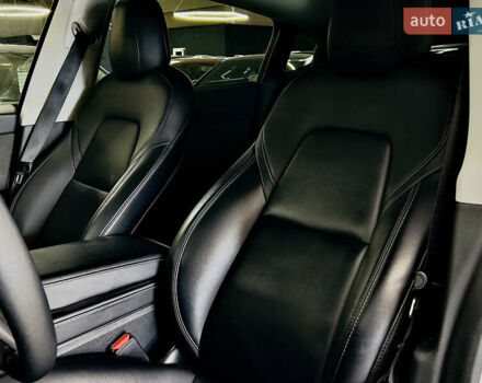 Білий Тесла Model Y, об'ємом двигуна 0 л та пробігом 74 тис. км за 24979 $, фото 10 на Automoto.ua