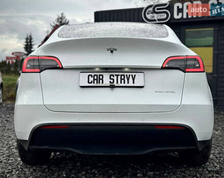 Білий Тесла Model Y, об'ємом двигуна 0 л та пробігом 62 тис. км за 27400 $, фото 60 на Automoto.ua