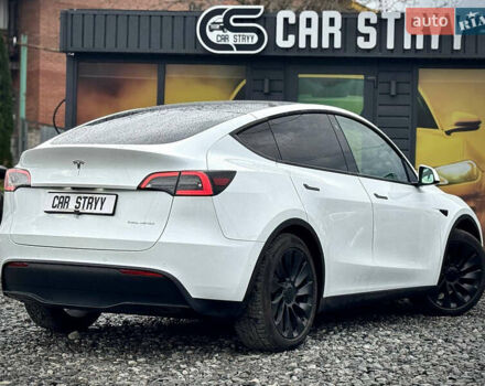 Білий Тесла Model Y, об'ємом двигуна 0 л та пробігом 62 тис. км за 27400 $, фото 48 на Automoto.ua