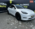 Белый Тесла Model Y, объемом двигателя 0 л и пробегом 61 тыс. км за 24700 $, фото 1 на Automoto.ua