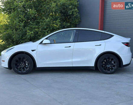 Белый Тесла Model Y, объемом двигателя 0 л и пробегом 55 тыс. км за 27999 $, фото 1 на Automoto.ua