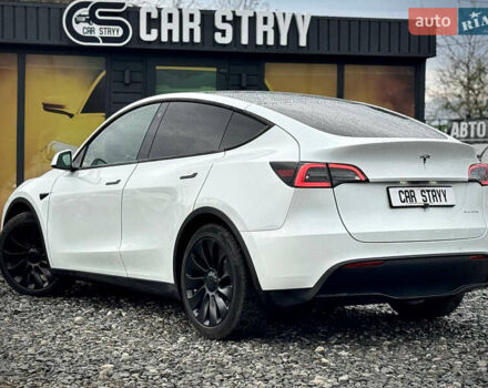 Білий Тесла Model Y, об'ємом двигуна 0 л та пробігом 62 тис. км за 27400 $, фото 54 на Automoto.ua
