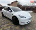 Білий Тесла Model Y, об'ємом двигуна 0 л та пробігом 59 тис. км за 24999 $, фото 1 на Automoto.ua