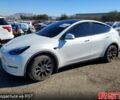 Белый Тесла Model Y, объемом двигателя 0.39 л и пробегом 26 тыс. км за 24900 $, фото 1 на Automoto.ua