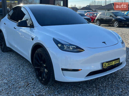 Білий Тесла Model Y, об'ємом двигуна 0 л та пробігом 73 тис. км за 24800 $, фото 1 на Automoto.ua