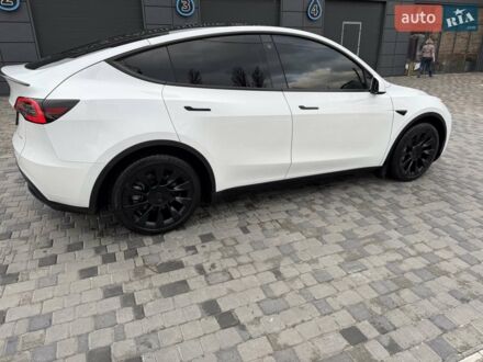 Белый Тесла Model Y, объемом двигателя 0 л и пробегом 66 тыс. км за 32000 $, фото 1 на Automoto.ua