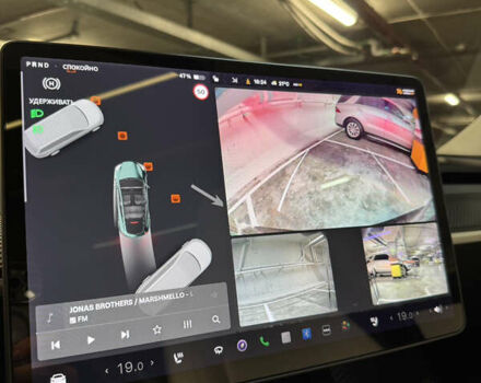 Черный Тесла Model Y, объемом двигателя 0 л и пробегом 33 тыс. км за 25900 $, фото 44 на Automoto.ua