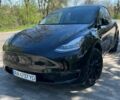 Черный Тесла Model Y, объемом двигателя 0 л и пробегом 100 тыс. км за 16000 $, фото 1 на Automoto.ua