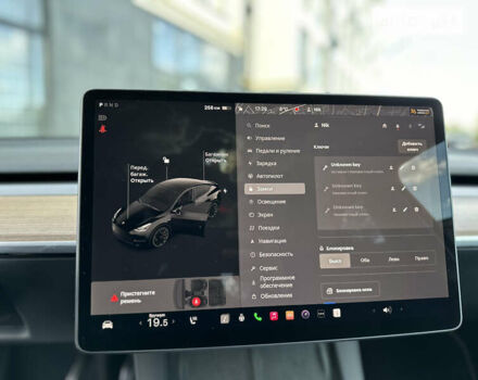 Черный Тесла Model Y, объемом двигателя 0 л и пробегом 2 тыс. км за 40990 $, фото 41 на Automoto.ua
