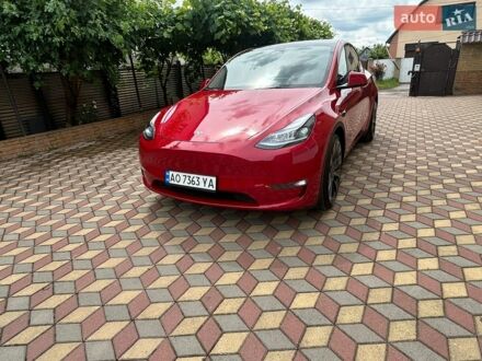 Червоний Тесла Model Y, об'ємом двигуна 0 л та пробігом 66 тис. км за 23850 $, фото 1 на Automoto.ua