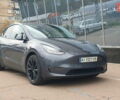 Серый Тесла Model Y, объемом двигателя 0 л и пробегом 84 тыс. км за 24999 $, фото 1 на Automoto.ua