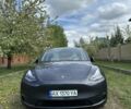 Серый Тесла Model Y, объемом двигателя 0 л и пробегом 28 тыс. км за 34900 $, фото 1 на Automoto.ua