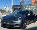 Серый Тесла Model Y, объемом двигателя 0 л и пробегом 58 тыс. км за 27999 $, фото 1 на Automoto.ua