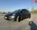 Серый Тесла Model Y, объемом двигателя 0 л и пробегом 99 тыс. км за 24999 $, фото 1 на Automoto.ua