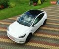 Серый Тесла Model Y, объемом двигателя 0 л и пробегом 4 тыс. км за 29999 $, фото 1 на Automoto.ua