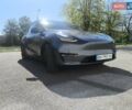 Серый Тесла Model Y, объемом двигателя 0 л и пробегом 77 тыс. км за 30999 $, фото 2 на Automoto.ua