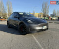 Серый Тесла Model Y, объемом двигателя 0 л и пробегом 99 тыс. км за 24999 $, фото 1 на Automoto.ua