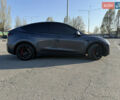 Серый Тесла Model Y, объемом двигателя 0 л и пробегом 99 тыс. км за 24999 $, фото 2 на Automoto.ua