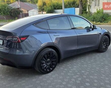 Серый Тесла Model Y, объемом двигателя 0 л и пробегом 77 тыс. км за 25499 $, фото 4 на Automoto.ua