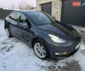Серый Тесла Model Y, объемом двигателя 0 л и пробегом 67 тыс. км за 26000 $, фото 1 на Automoto.ua